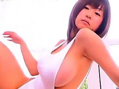 Mouth-watering Japanese babe Hitomi Kitamura poses on cam wearing seductive white swim suit